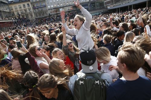 Fans gather to honour late Swedish DJ Avicii. (AAP)