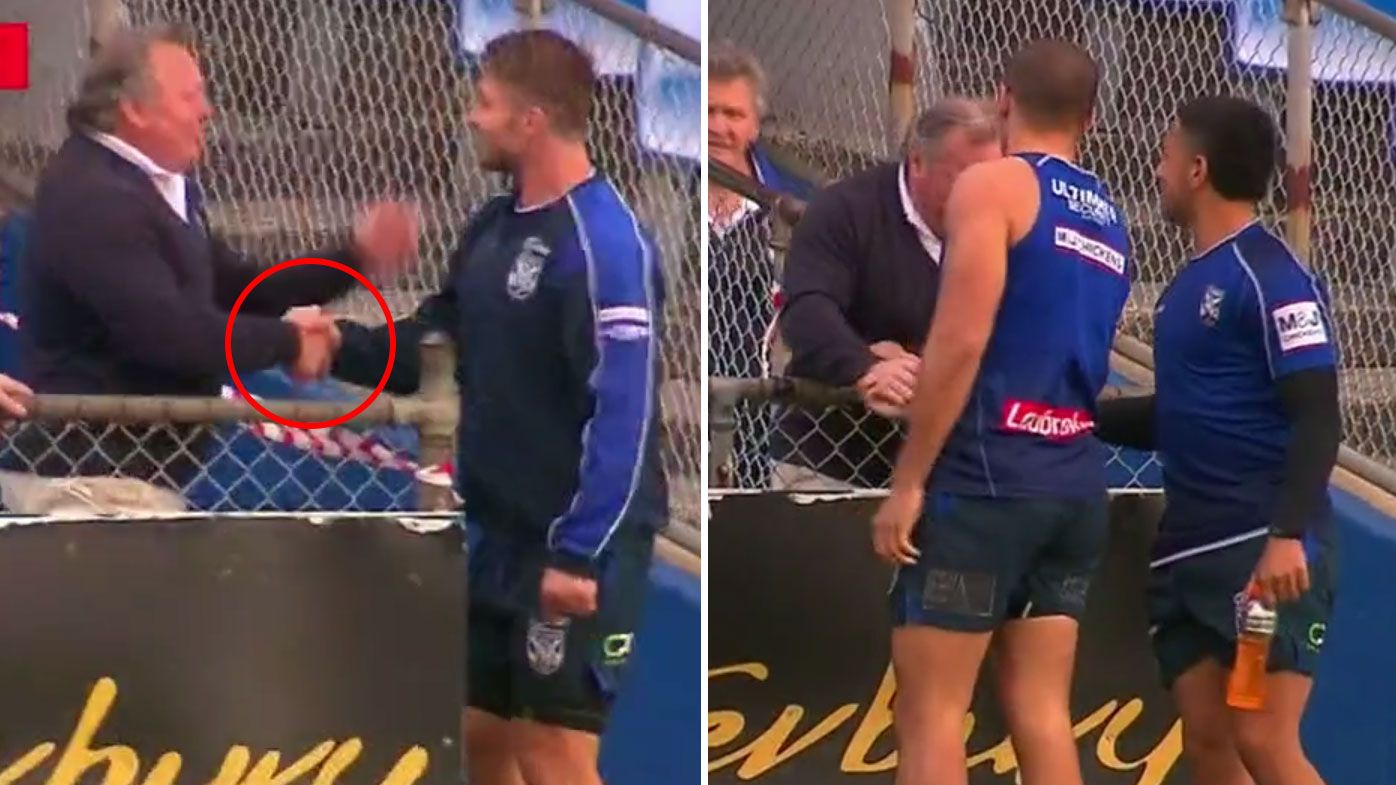 Terry Lamb shakes hands with Bulldogs players at training