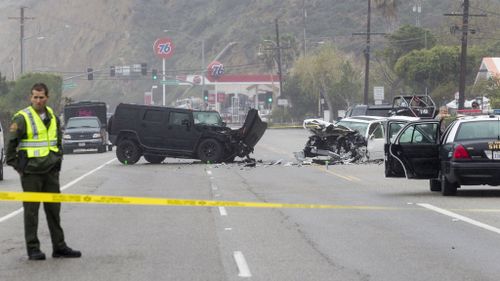 A 69-year-old woman was killed when her car was hit by an oncoming Humvee. (AAP)