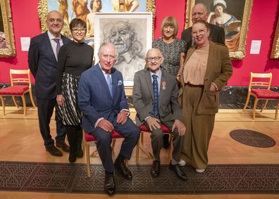 The Prince of Wales and The Duchess of Cornwall attended an exhibition of Seven Portraits: Surviving the Holocaust, which were commissioned by The Prince of Wales to pay tribute to Holocaust survivors, at The Queens Gallery, Buckingham Palace, London.  The Prince of Wales with the family of Ziggi Shipper and the artist Jenny Saville (right)  Pictures: Arthur Edwards.