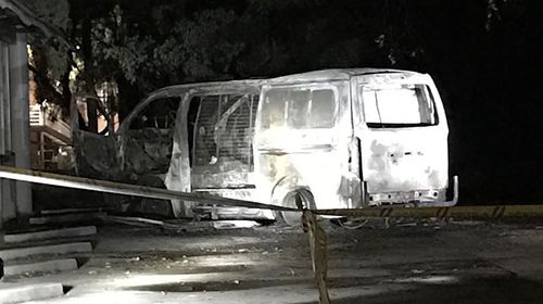 The burnt-out van before it was towed from the scene. (AAP)