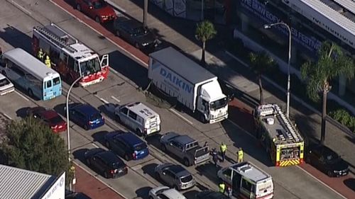 Man charged after woman hit by two trucks in Sydney's Northern Beaches