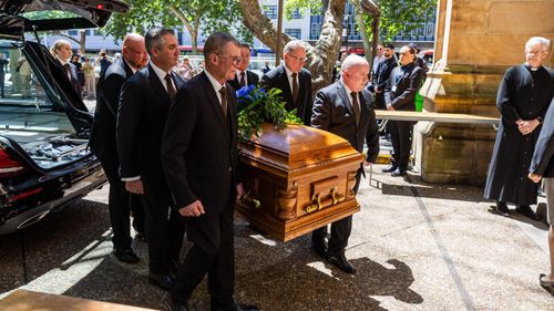 The coffin arrives at the state funeral for broadcaster John Laws, at St Andrews Church, in Sydney, Wednesday, 19 November 2025. Photo: Sam Mooy / The Sydney Morning Herald
