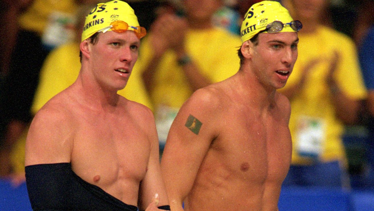 Kieren Perkins and Grant Hackett of Australia celebrates their silver and gold medals in the men&#x27;s 1500m freestyle final held at the Sydney International Aquatic Centre during the Sydney 2000 Olympics.