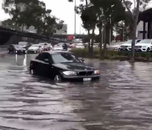 Cars have been submerged, leaving some motorists pushing their cars through the floodwaters. 