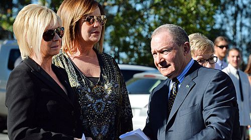 Nine Network's Liz Hayes, Tracy Grimshaw and Steve Liebmann arrive at Ross' funeral in 2014. (AAP) 