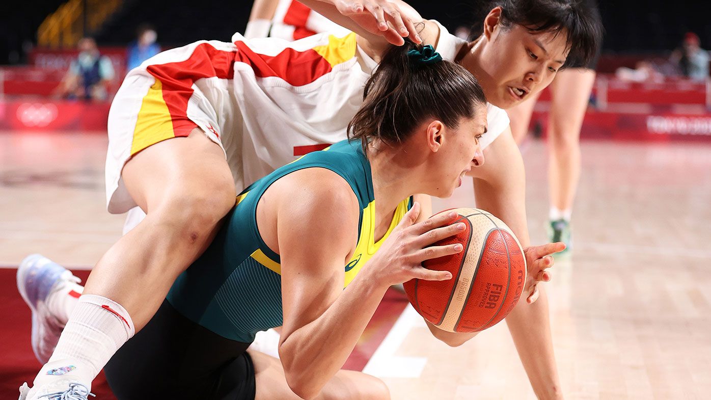 Yueru Li of Team China and Marianna Tolo of Team Australia fight for possession of the ball during the second half of a Women&#x27;s Basketball Preliminary Round Group match between Australia and Puerto Rico at the Tokyo Olympics.