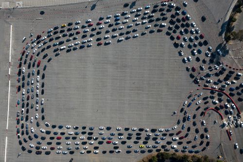 Motorists line up to take a coronavirus test in a parking lot at Dodger Stadium in Los Angeles. During the pandemic, the differences between the haves and have nots was once again made very stark, with access to medical supplies, vaccines and test kits.