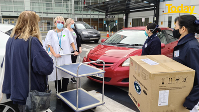 Grateful healthcare workers receive a delivery of essential supplies.