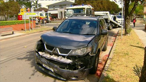 The black Mitsubishi SUV involved in the alleged fake crash.