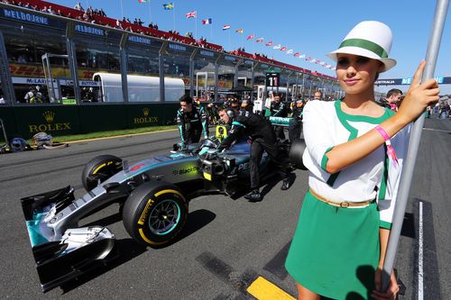 A grid girl holding a sign at the Melbourne Grand Prix in 2016. (AAP)