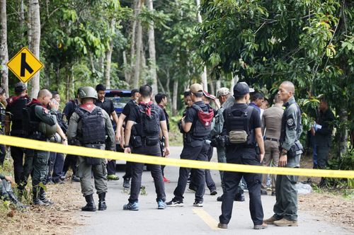 Gunmen fired at security personnel at checkpoints in Thailand's insurgency-wracked south, killing 14 volunteer officers and wounding five others, police said Wednesday. (AP Photo/Sumeth Panpetch)