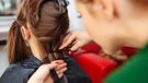 Girl getting hair cut short