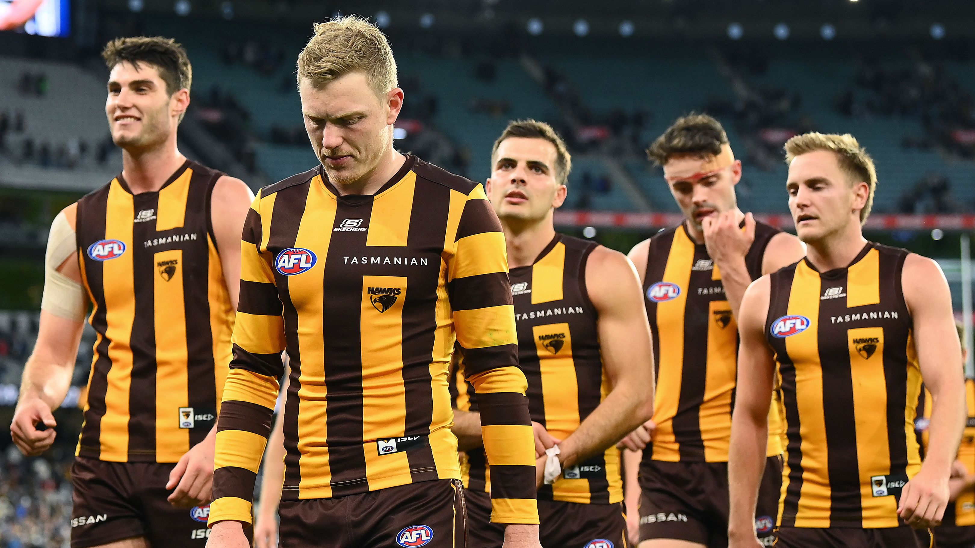 MELBOURNE, AUSTRALIA - APRIL 10: The Hawks look dejected after losing the round four AFL match between Geelong Cats and Hawthorn Hawks at Melbourne Cricket Ground, on April 10, 2023, in Melbourne, Australia. (Photo by Quinn Rooney/Getty Images)
