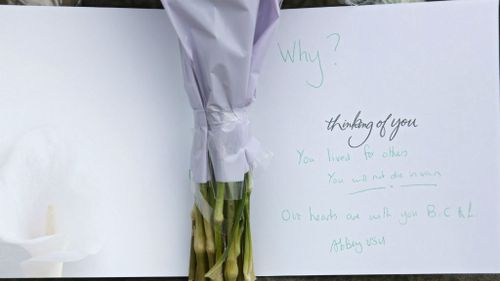 Flowers and condolence messages were placed at a statue of Joseph Priestley near the scene in Birstall.(AAP)