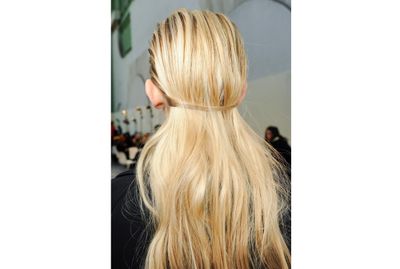 <p>At Guy Laroche, two pieces from the front of the hair were pulled back to create a band, with the remaining hair cascading beneath. This is a great solution for rainy days when you want to wear your hair out.</p>