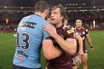 Isaah Yeo embraces Cameron Munster after game two of the 2025 State of Origin series. 