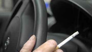 Smoking with children in the car has been outlawed in Scotland. (AAP)