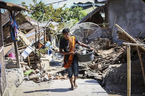 Tourists and local residents have been left in chaotic conditions after a 7.0-magnitude earthquake devastated Indonesia's Lombok and Gili Islands. Picture: AAP.