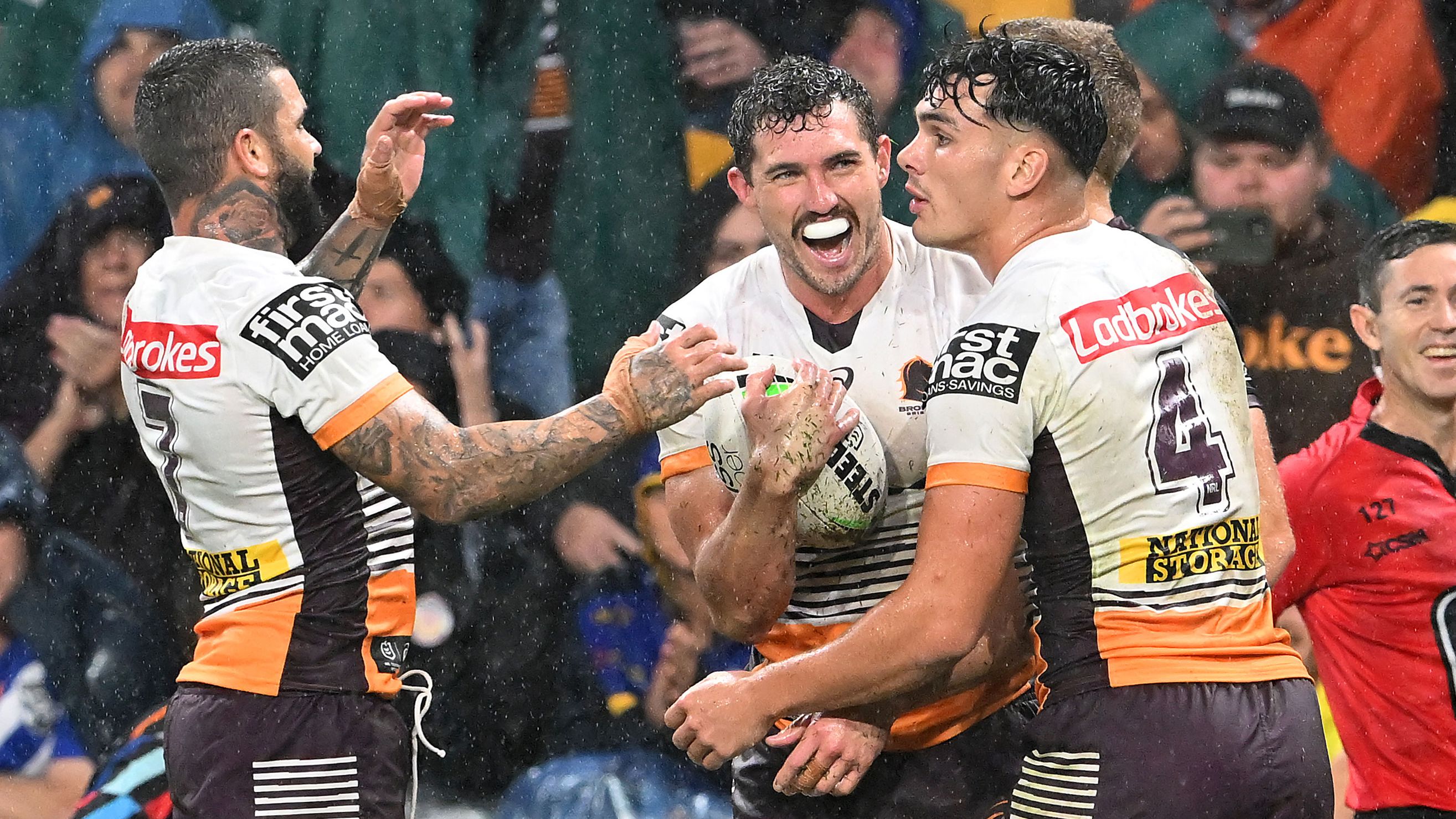 The Broncos celebrate a Corey Oates try against Manly in Magic Round.