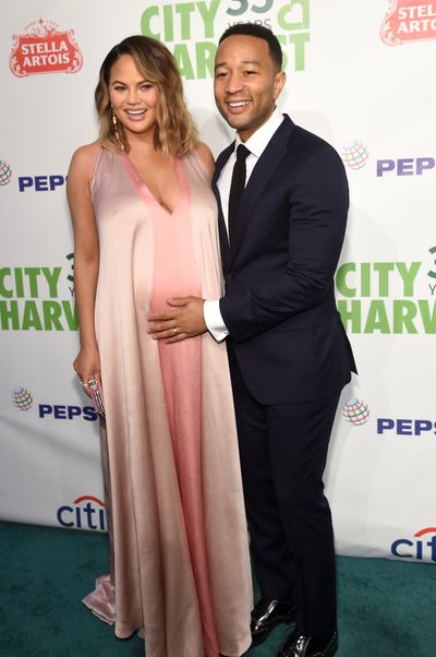 Chrissy Teigen, in Valentino, and husband John Legend at City Harvest's 35th Anniversary Gala in New York in April, 2018