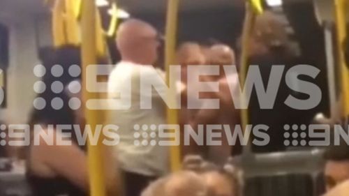 The man and the teens can be seen having a heated discussion. (9NEWS)