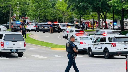 Police outside a hospital in Tulsa where a mass shooting took place.