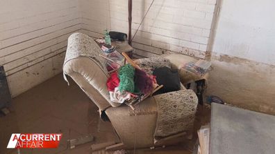 Flood damage inside Erma Crane's house.