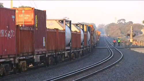 A car was pushed onto train tracks by another car this morning, causing it to be hit by an approaching train.