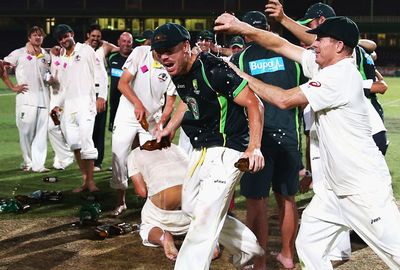How sweet it is! Players happily soak each other in beer on the SCG pitch.