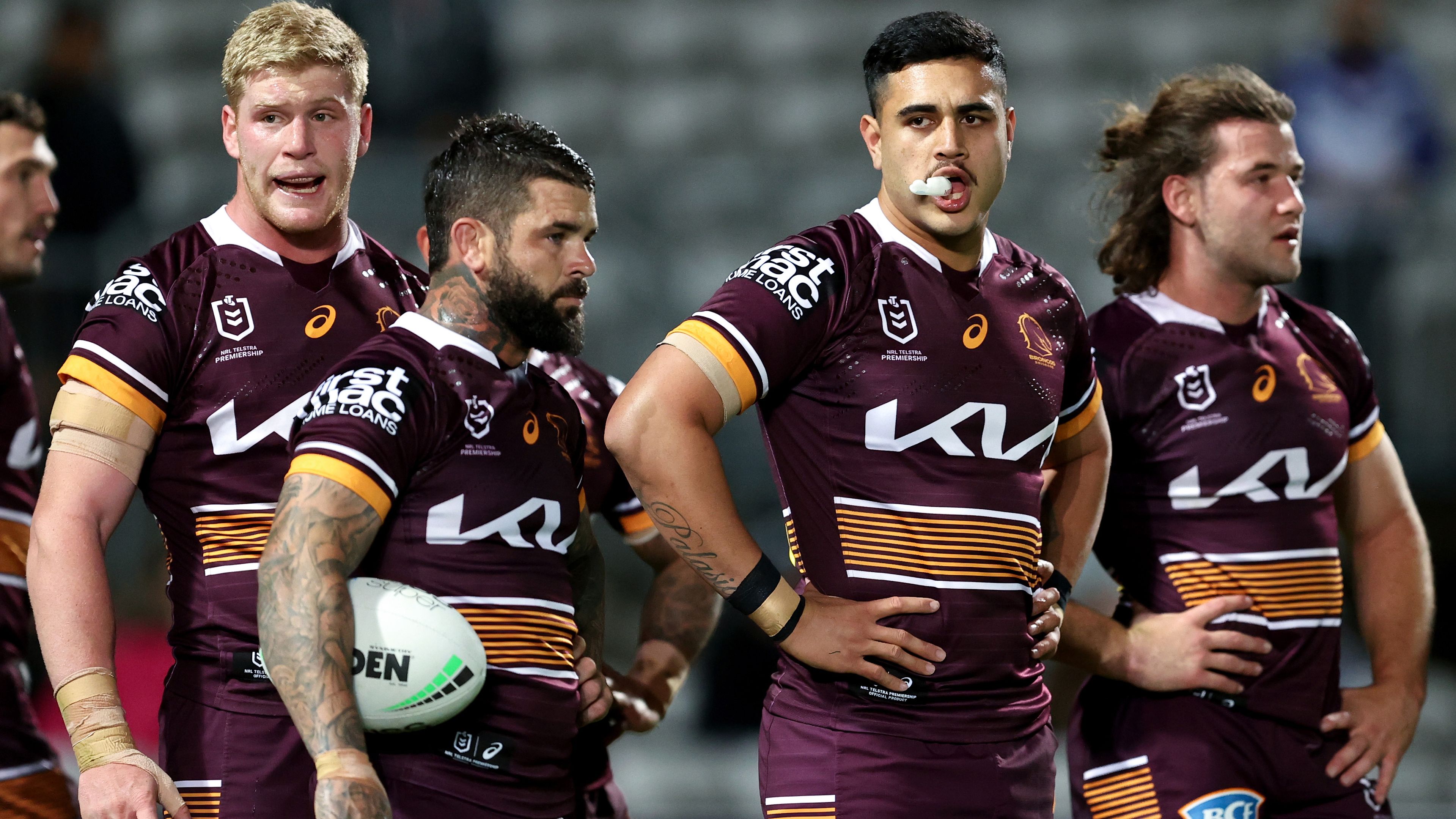 Brisbane Broncos players react during their loss to the Dragons in round 25.