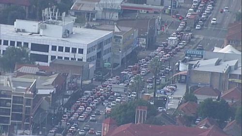 Motorcycle and bus collision cripples traffic in Sydney's inner west