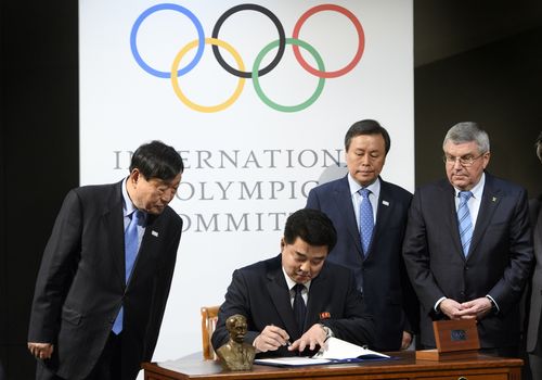 A signing ceremony during the North and South Korean Olympic Participation Meeting at the Olympic Museum of the IOC yesterday. (AAP) 