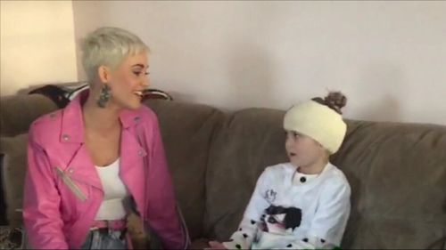 Katy Perry has surprised eight-year-old superfan Grace Moores at her home after brain surgery meant she was unable to go to the singer's concert. Picture: Supplied