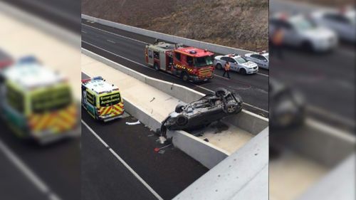 Driver critical after car plunges over Adelaide bridge onto freeway below