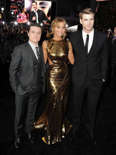 Actors Josh Hutcherson, Jennifer Lawrence, and Liam Hemsworth arrive at the premiere of Lionsgate's "The Hunger Games" at Nokia Theatre L.A. Live on March 12, 2012 in Los Angeles, California.