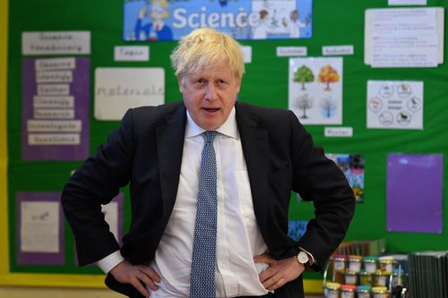 Britain's Prime Minister Boris Johnson visits the Field End Infant school, in South Ruislip, London, Friday May 6, 2022, following the local government elections. 