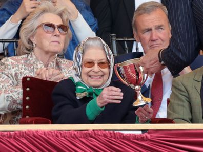 Queen Elizabeth II receives the winners cup at The Royal Windsor Horse Show at Home Park on May 13, 2022 in Windsor, England. 
