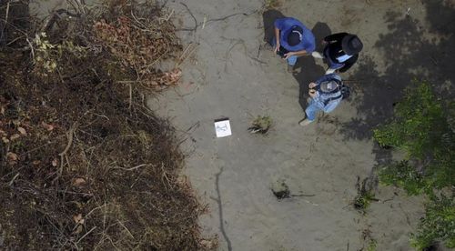 Workers at the site of clandestine burial pits in the Gulf coast state of Veracruz, Mexico.