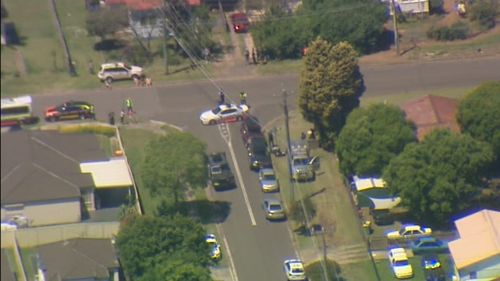 Police cars and armoured Bearcat vehicles have been deployed to the area as police scour the streets. (9NEWS)