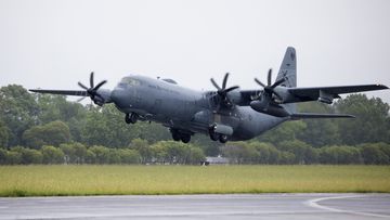 In this photo provided by the Australian Defense Force, a Royal Australian Air Force C-130J Hercules aircraft departs from Richmond, Australia Tuesday, Jan. 18, 2022, to assist the Tonga government after the eruption of an undersea volcano. (CPL Kylie Gibson/Australian Defense Force via AP)