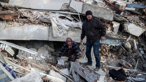 People search the collapsed building to hear a sound from their loved ones, on February 07, 2023 in Hatay, Turkey. 