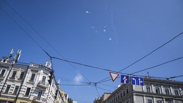 Tracks and white smoke are seen in the sky during Russian rocket attack in Kyiv, Ukraine, Monday, May 29, 2023. 