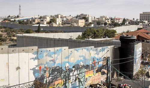 A view from the refugee camp Aida of a watch tower and the security wall between the Palestinian town of Bethlehem and the Israeli area as seen on November 04, 2013 in Bethlehem, The Palestinian Territories. (Getty)