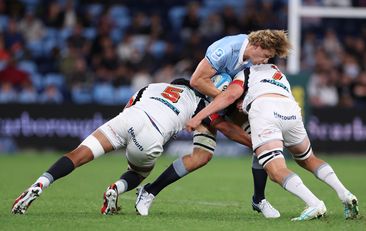 Ned Hanigan of the Waratahs is challenged by Tupou Vaa&#x27;i and Kaylum Boshier of the Chiefs
