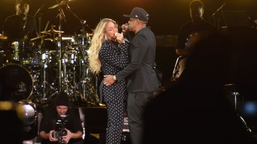 The power-couple treated the crowd to a special duet. (Getty)