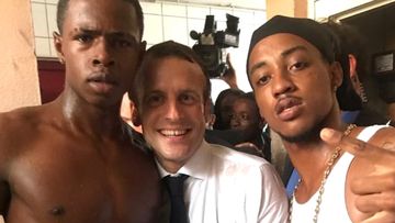 French President Emmanuel Macron has come under attack from far-right leader Marine Le Pen over a photograph taken during his visit to the Caribbean last week.  The photo emerged on social media showing Macron with the two young men, one of whom made a rude gesture; the other has a prior conviction.