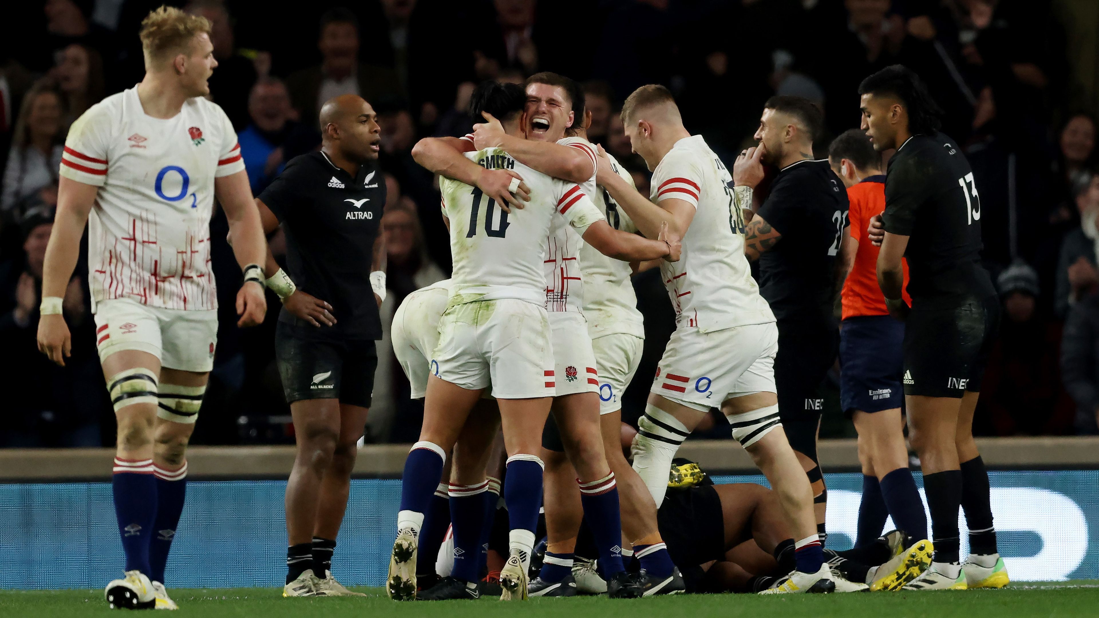 Marcus Smith and Owen Farrell of England celebrate their third try over New Zealand at Twickenham Stadium.
