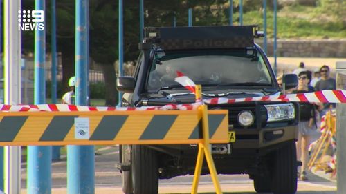 Riot police patrolling Coogee Beach today.