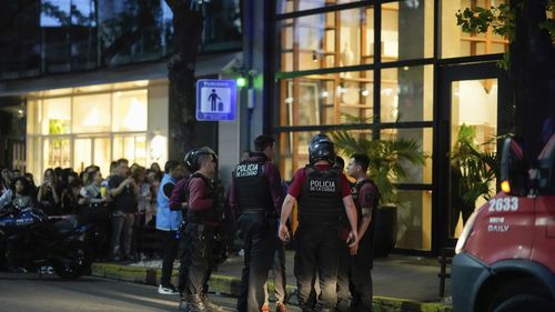 Police gather outside a hotel where Liam Payne, a former member of the band One Direction, was found dead after falling from a balcony in Buenos Aires, Argentina, Wednesday, Oct. 16, 2024.